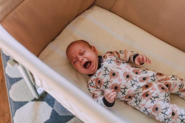baby crying in crib