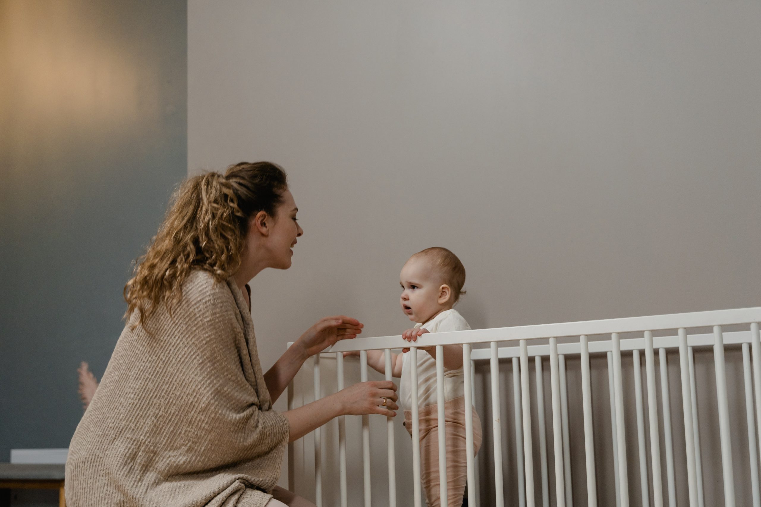 baby standing in crib
